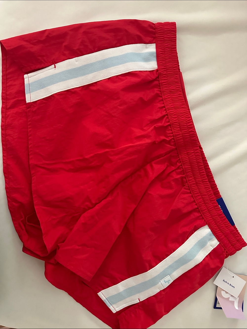 Red women’s Athletic Shorts with Light Blue Trim